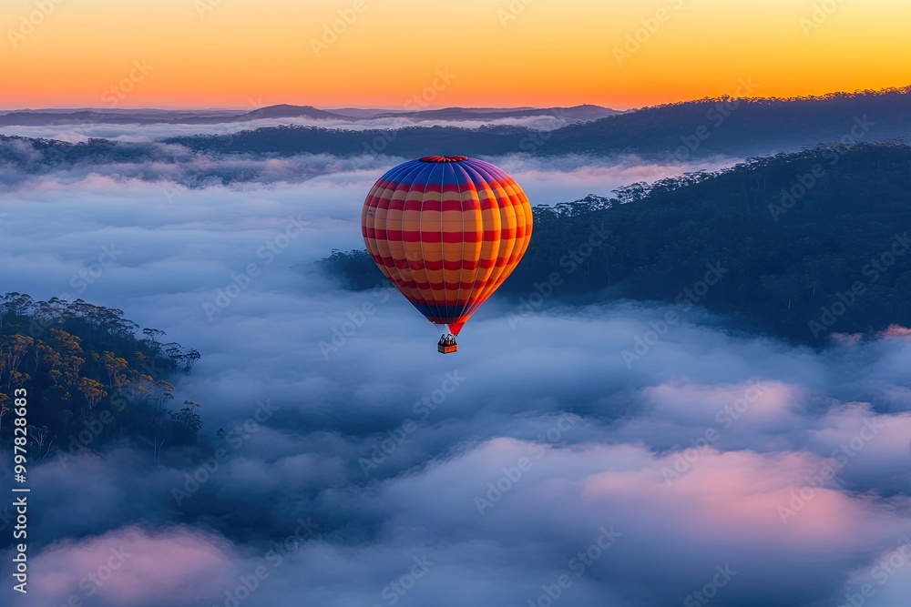 Fototapeta premium Hot Air Balloon Floating Above Clouds at Sunrise