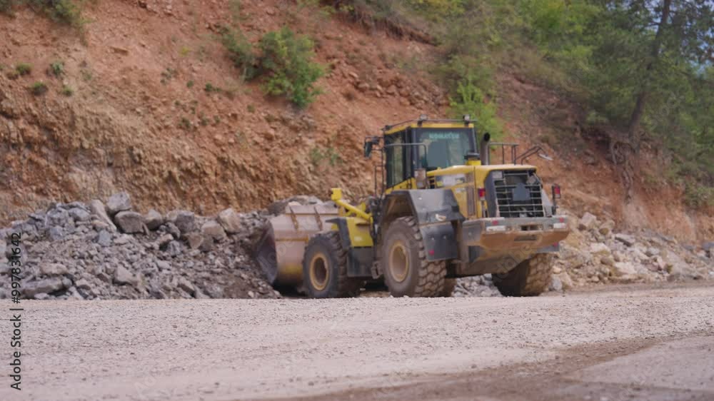 Wheel loader machinery take crushed rocks in metal bucket, quarry in Czechia Wheel loader machinery take crushed rocks in metal bucket, quarry in Czechia