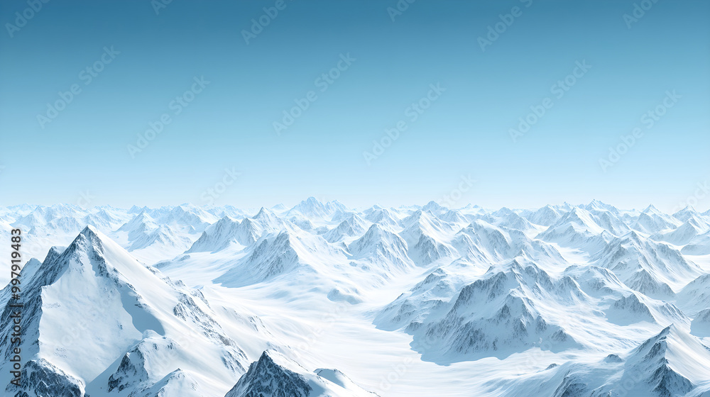Obraz premium A vast snow-covered mountain range stretching into the horizon with clear blue skies above
