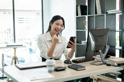 Young woman celebrate successful stock trading