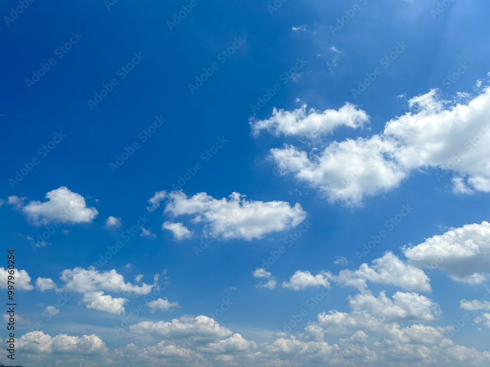 Enjoy the beautiful sky and clouds of Thailand. Background sky gradient. Stratocumulus clouds a mix of stratus clouds and cumulus clouds with blue sky background at Thailand. Enjoy the beautiful sky and clouds of Thailand. Background sky gradient. Stratocumulus clouds a mix of stratus clouds and cumulus clouds with blue sky background at Thailand.
