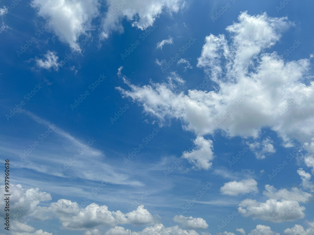 Obraz premium Enjoy the beautiful sky and clouds of Thailand. Background sky gradient. Stratocumulus clouds a mix of stratus clouds and cumulus clouds with blue sky background at Thailand.