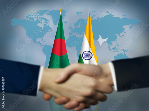 Картината върху платно Two people shaking hands in front of Bangladesh and India flags