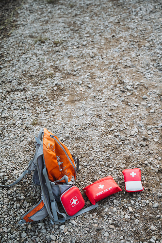 An AdventureReady First Aid Kit is included, and a sturdy Backpack is perfect for carrying it along while hiking on a Gravel Path photo