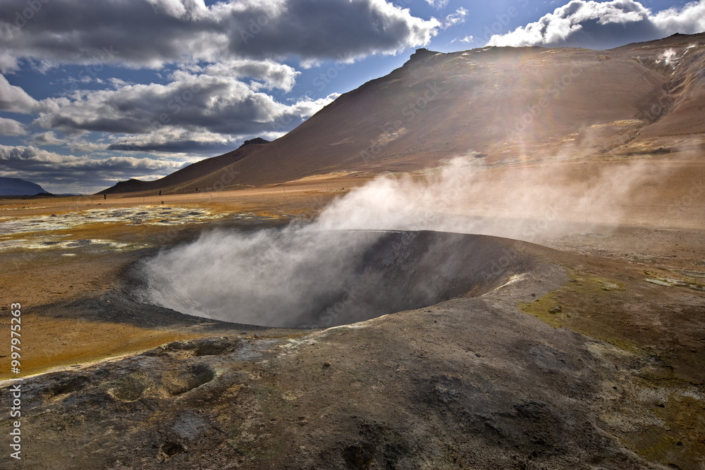 Amazing lava field in the highlands of Iceland near Myvatn, black old lava flows and volcanic rocks, mountains in the background Amazing lava field in the highlands of Iceland near Myvatn, black old lava flows and volcanic rocks, mountains in the background