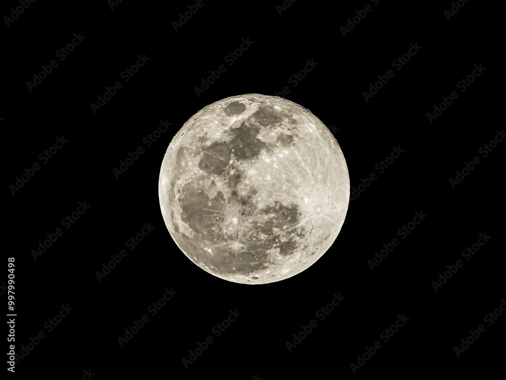 Fototapeta premium Close-up photo of the moon during a full moon at night isolated on black background.