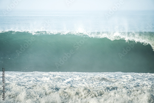 Dangerous high tide wave on the beach. Congot beach Kulon Progo, Yogyakarta, Indonesia. photo