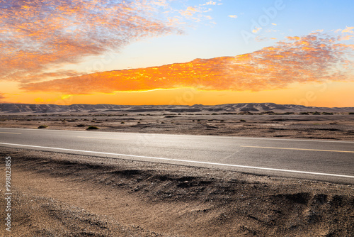 Asphalt highway road and desert natural landscape at sunset. Car background.