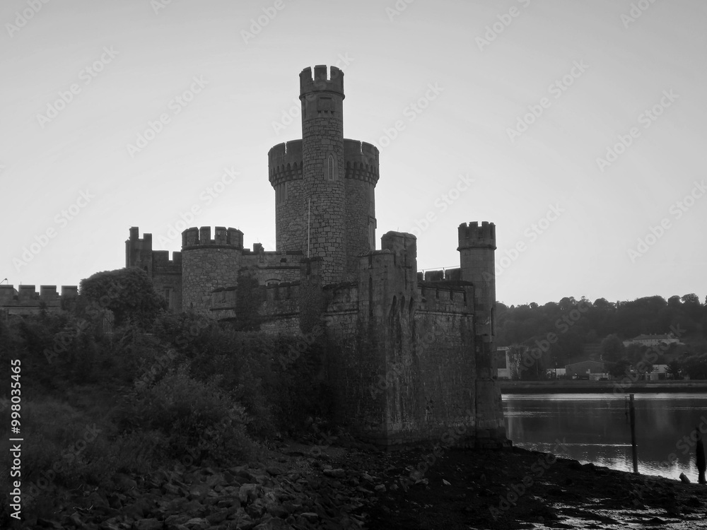 Blackrock castle observatory silhouette in the rays of sunset sun black and white monochrome background Blackrock castle observatory silhouette in the rays of sunset sun black and white monochrome background