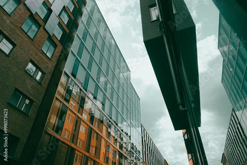 Wallpaper Mural Low angle view of buildings against cloudy sky Torontodigital.ca
