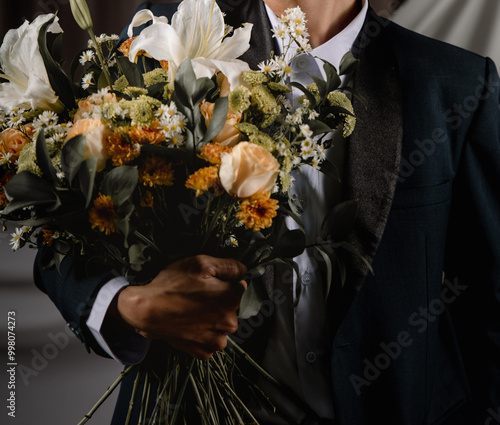 person in a suit with flower valentine romance