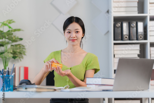 Confident Young Businesswoman Presenting Product