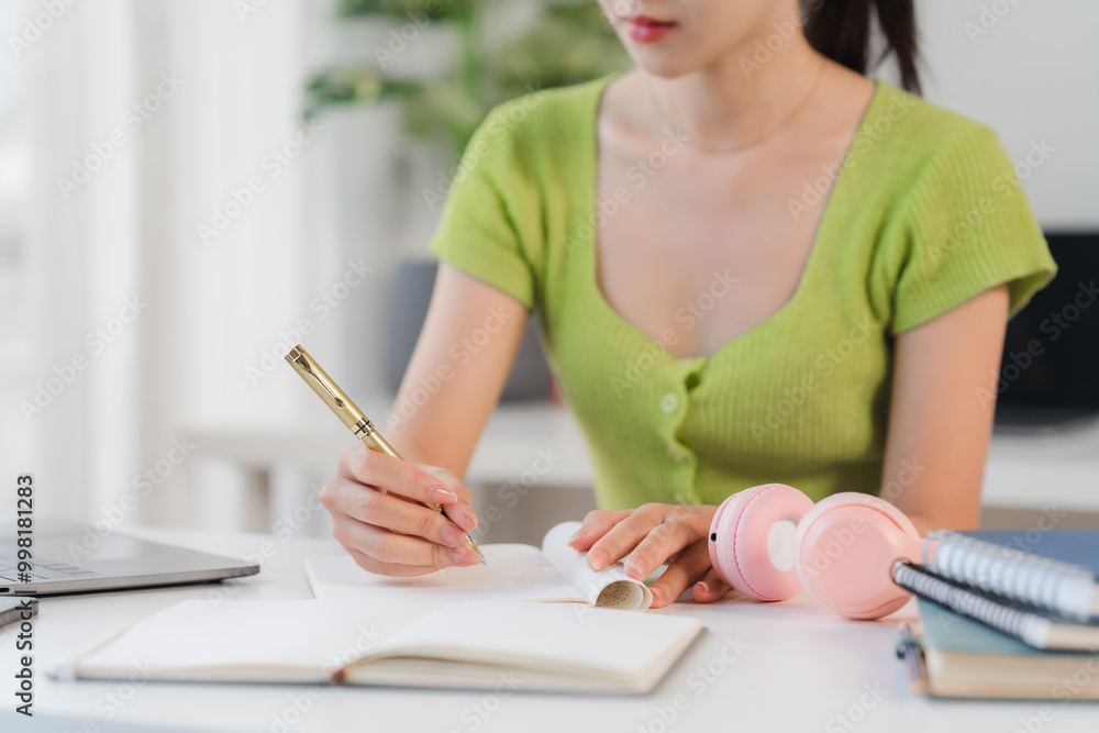 Focused Student: Young Woman Studying at Home Focused Student: Young Woman Studying at Home