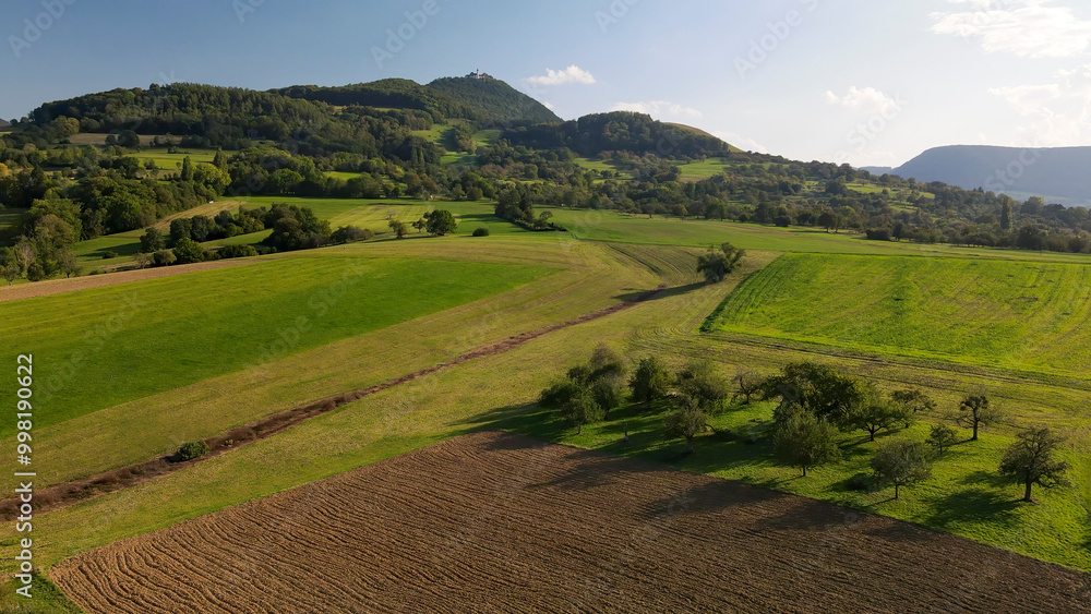 A flight above Dettingen Teck towards the Castle Teck which is located high above the mountain A flight above Dettingen Teck towards the Castle Teck which is located high above the mountain