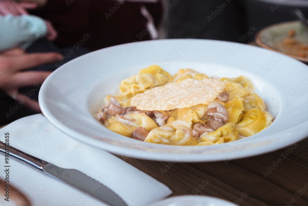 Italian plate of pasta served on restaurant. Classic italian cuisine dish. Popular italian food. Italian plate of pasta served on restaurant. Classic italian cuisine dish. Popular italian food.
