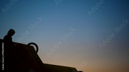 A cyclist jumps on a skypark against the sky