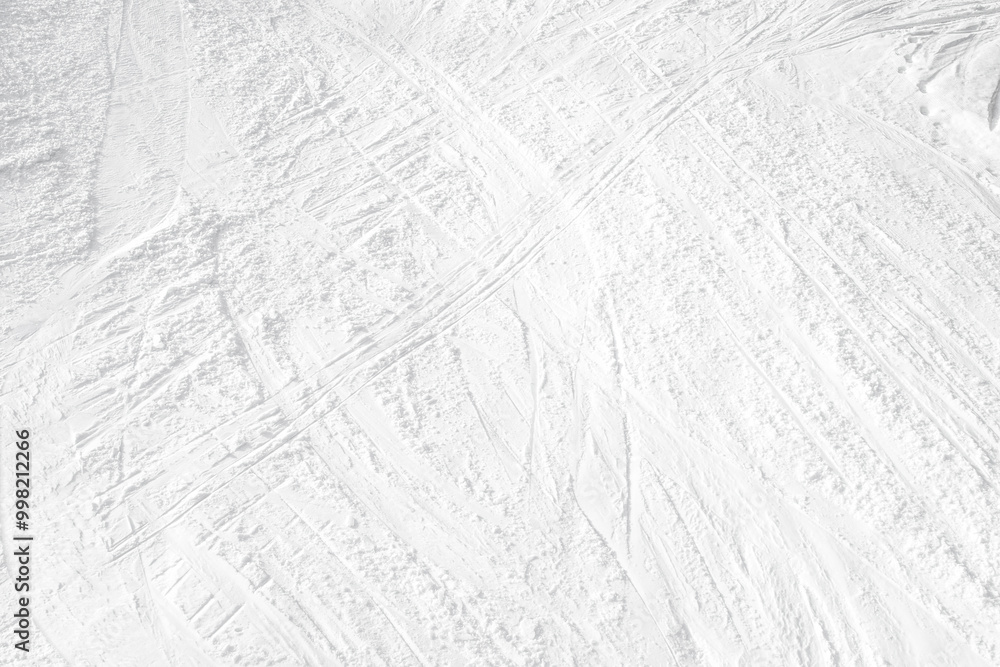 Obraz premium Top View of White Ski Tracks on Snow Background