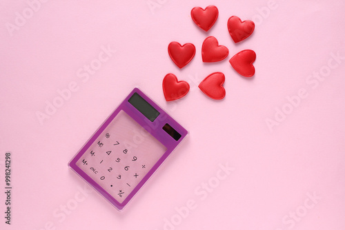 Calculator with hearts on a pink background