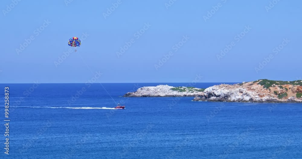 Parasailing over the bay Bali isle of Crete. Greece, Mediterranian sea Parasailing over the bay Bali isle of Crete. Greece, Mediterranian sea