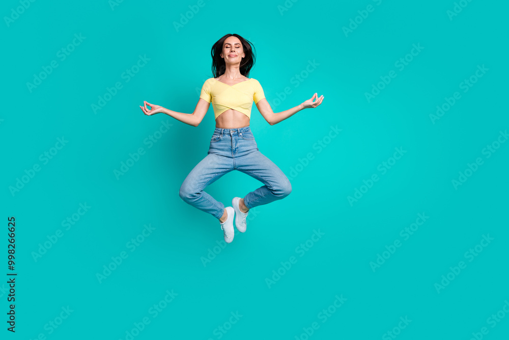 Full body portrait of nice young woman jump meditate wear top isolated on turquoise color background