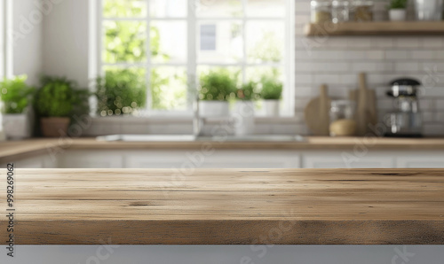 An empty, beautiful wooden table and a blurred modern kitchen interior in a clean home, providing a background for product display montage or branding with copy space.