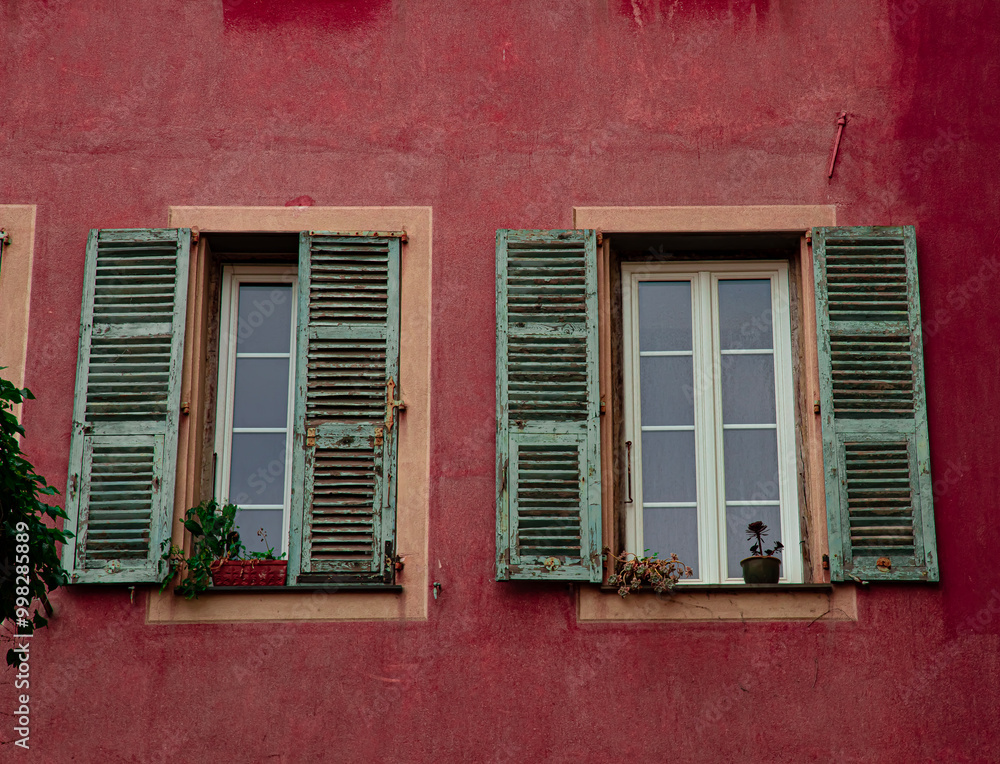 old windows on red building old windows on red building