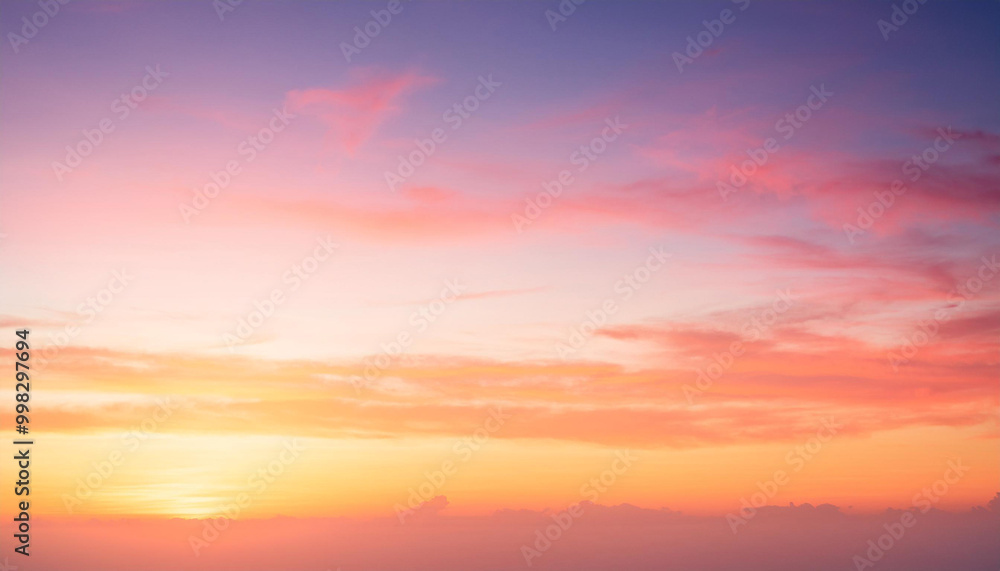 Fototapeta premium Colorful sunset sky in the morning with Yellow, Orange and pink sunrise sky with romantic sweet golden hour horizon sunshine summer background