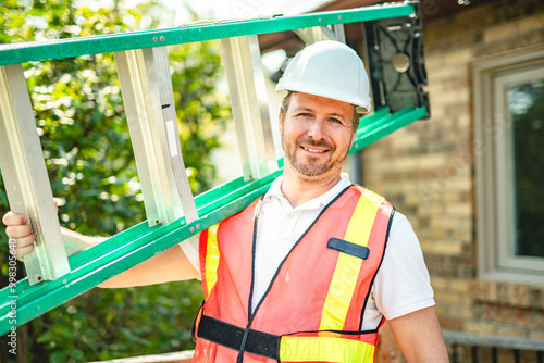Принти на полотні inspector or engineer with ladder checking the building structure and house roof specifications