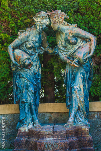 statues of odalisques with jugs photo