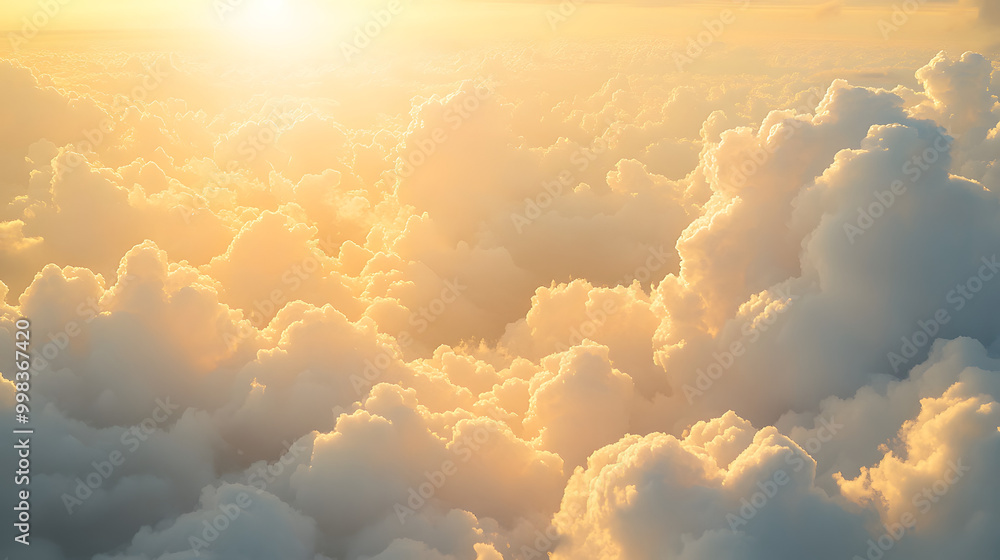 Fluffy cumulus clouds drift across the blue sky, casting soft shadows on the sunlit landscape below Fluffy cumulus clouds drift across the blue sky, casting soft shadows on the sunlit landscape below