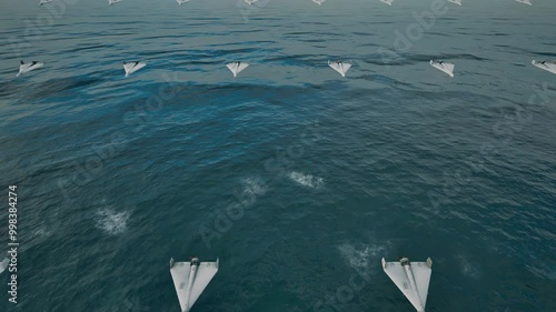 A formation of fixed-wing unmanned combat aerial vehicles (UCAVs), flying at low altitude over the ocean toward their designated targets. photo