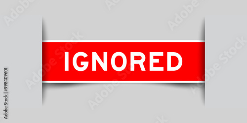 Red color square shape sticker label with word ignored inserted in gray background