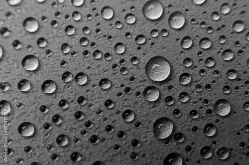 Wallpaper Mural Top view of rain water droplets on black cover background. Water droplets concept. Torontodigital.ca