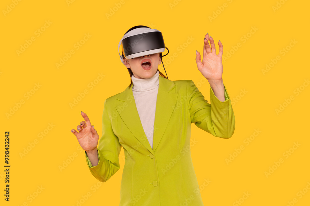 Woman Explores Virtual Reality in Vibrant Yellow Setting While Wearing Modern VR Headset Woman Explores Virtual Reality in Vibrant Yellow Setting While Wearing Modern VR Headset