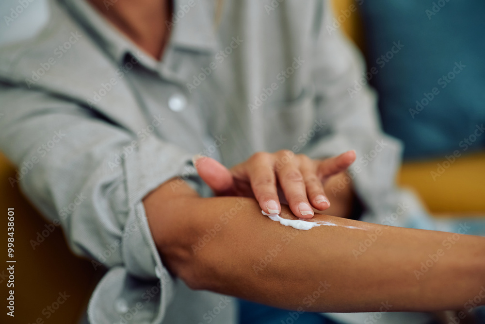 Fototapeta premium Close up of woman taking care of her skin.