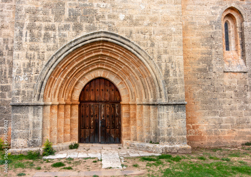 Wallpaper Mural Primitive door of the church of Santa Maria la Real from the 10th century in the town of Sasamon. Burgos, Castile and Leon, Spain. Torontodigital.ca