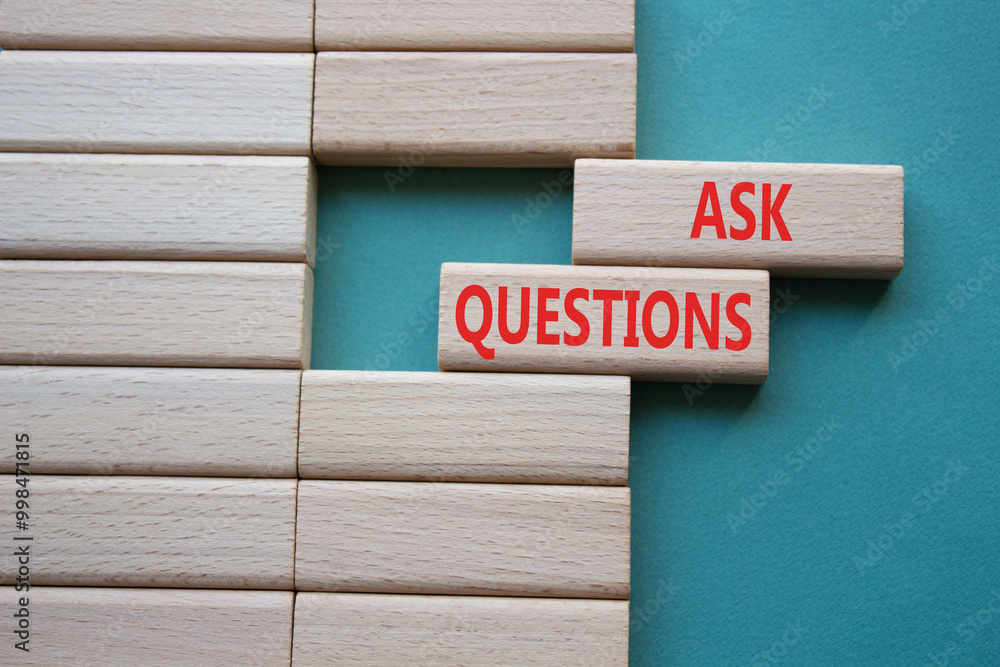 Ask Questions symbol. Wooden blocks with words Ask Questions. Beautiful grey green background. Business and Ask Questions concept. Copy space. Ask Questions symbol. Wooden blocks with words Ask Questions. Beautiful grey green background. Business and Ask Questions concept. Copy space.