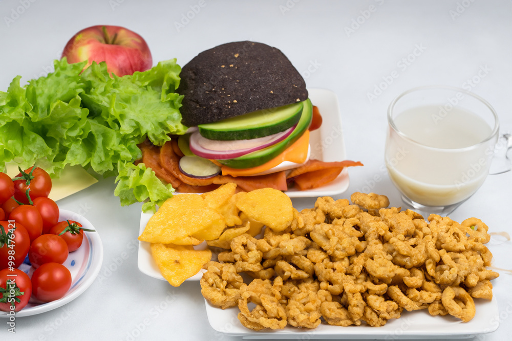 Healthy natural organic fresh vegetarian food and unhealthy processed fast junk food Healthy natural organic fresh vegetarian food and unhealthy processed fast junk food