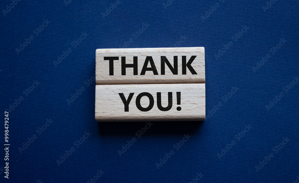 Thank you symbol. Wooden blocks with words Thank you. Beautiful deep blue background. Business and Thank you concept. Copy space. Thank you symbol. Wooden blocks with words Thank you. Beautiful deep blue background. Business and Thank you concept. Copy space.