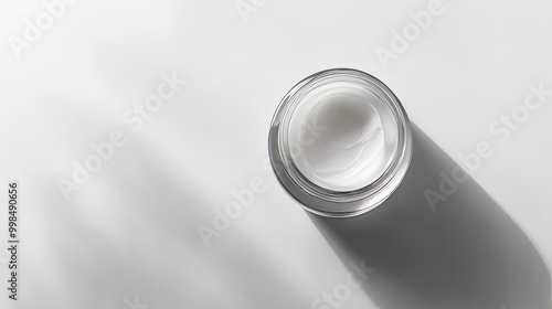 Against a white creamy foam background, glossy paint drops adorn the surface.
