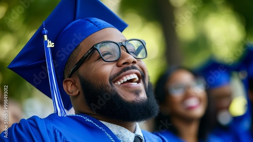 Graduating with a cap and gown, displaying the joy of achievement and a new chapter in life. photo