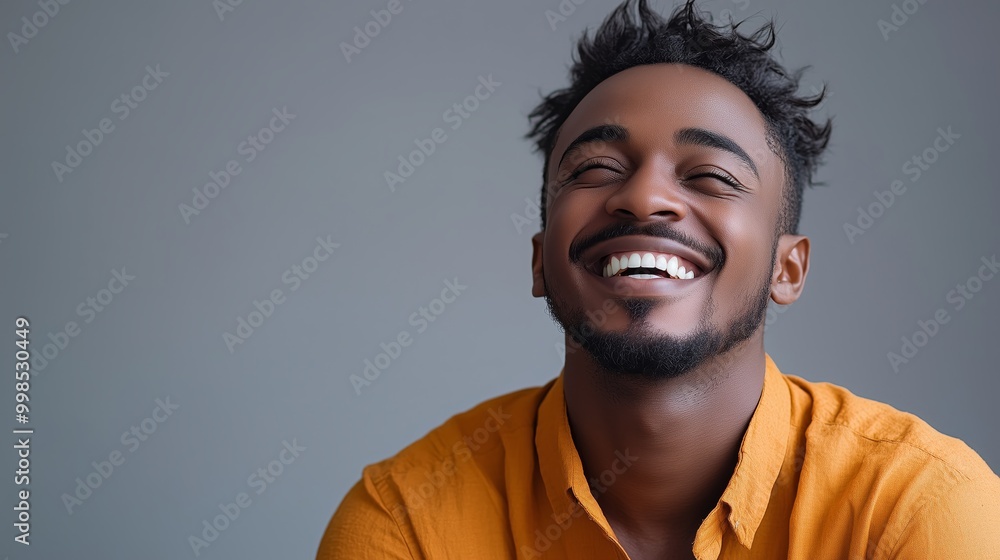 Portrait of a happy handsome man in a shirt with laughing