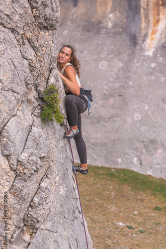 A strong woman rock climbing