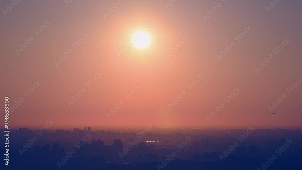 A peaceful evening scene with a city skyline framed by a glowing sunset. The soft, diffused light casts a warm glow over the urban landscape. Photographed in Shulin, Taiwan. A peaceful evening scene with a city skyline framed by a glowing sunset. The soft, diffused light casts a warm glow over the urban landscape. Photographed in Shulin, Taiwan.