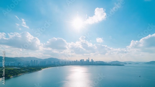 Serene Cityscape Under Bright Blue Sky and Clouds