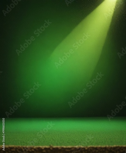 A spotlight shines on a green carpet, casting a warm glow and highlighting the texture of the carpet