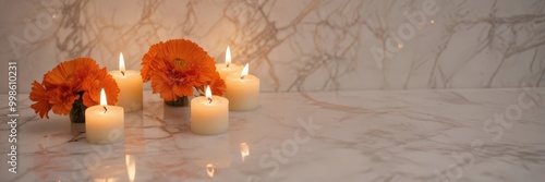 Six white candles with orange flowers in vases are arranged on a marble countertop, with the background blurred to focus attention on the candles