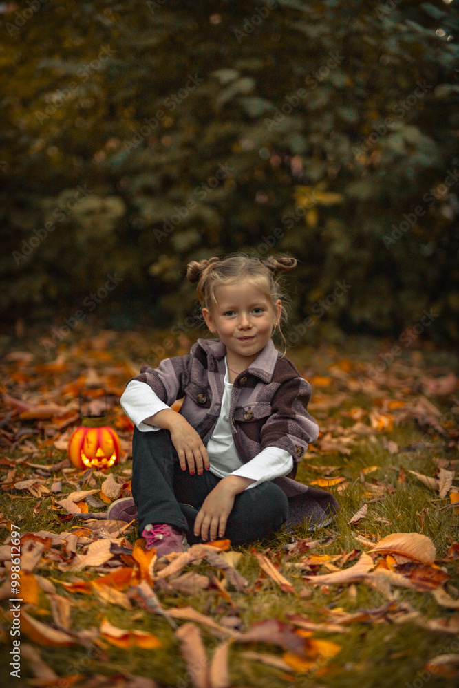 little girl smiles in a Halloween in Park in autumn little girl smiles in a Halloween in Park in autumn