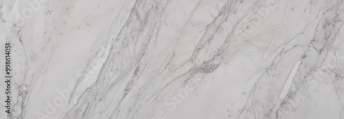 a close-up view marble surface, with a textured and irregular pattern of white and gray marble
