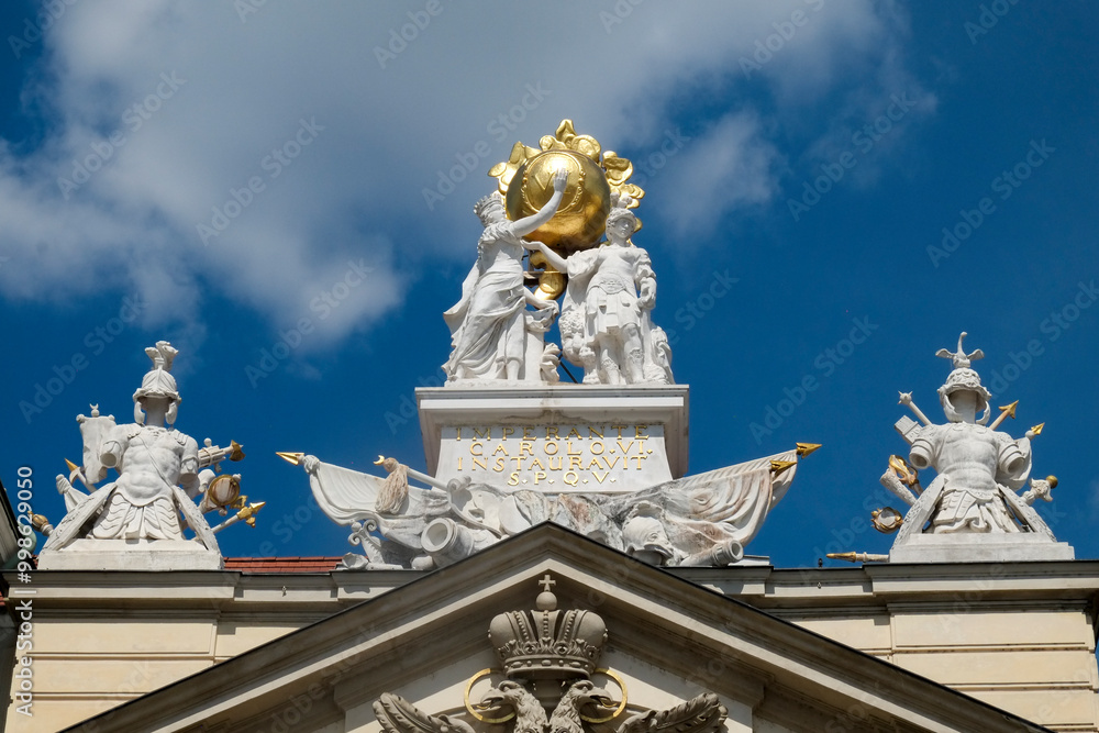 Vienna, Austria, Europe. Sculptures sit high atop a building in Vienna. Vienna, Austria, Europe. Sculptures sit high atop a building in Vienna.
